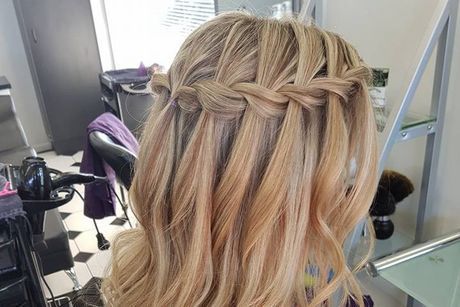 A Woman is Getting Her Hair Done in a Salon With a Waterfall Braid — Lush Hair Studio in Tumbi Umbi, NSW