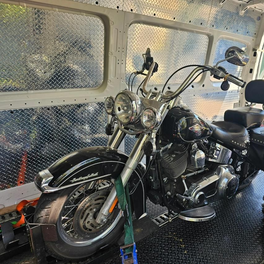 A Harley Davidson Motorcycle Is Sitting Inside Of A Van — Motow Motorcycle Transport In Sydney, NSW