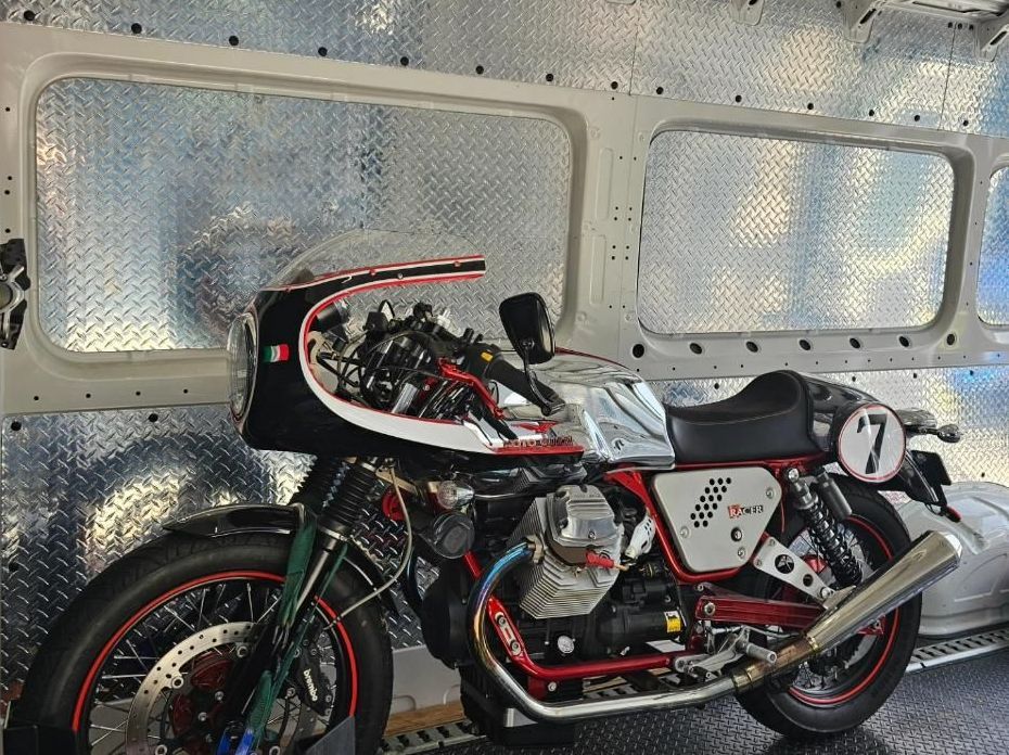 A Motorcycle On The Back Is Parked Inside Of A Van — Motow Motorcycle Transport In Sandgate, NSW