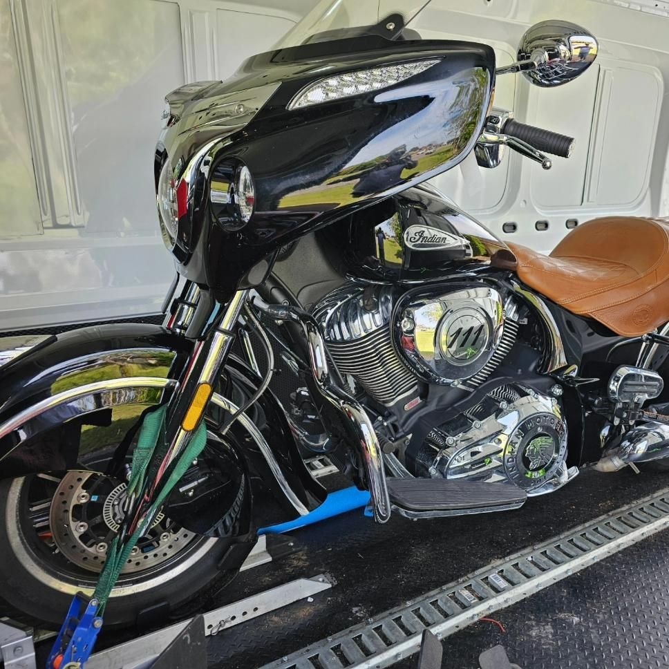 A Black Motorcycle Is Sitting On Top Of A Trailer — Motow Motorcycle Transport In Sandgate, NSW