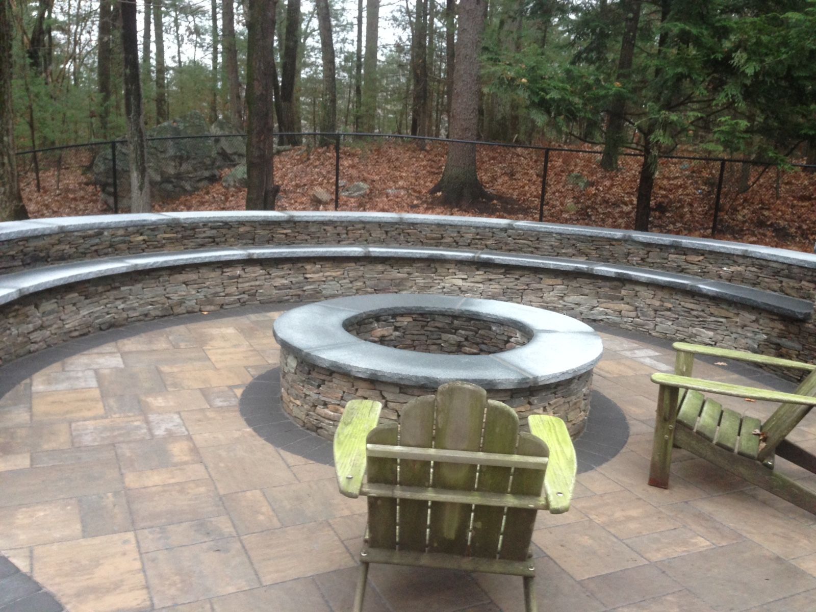 There is a fire pit in the middle of the patio.