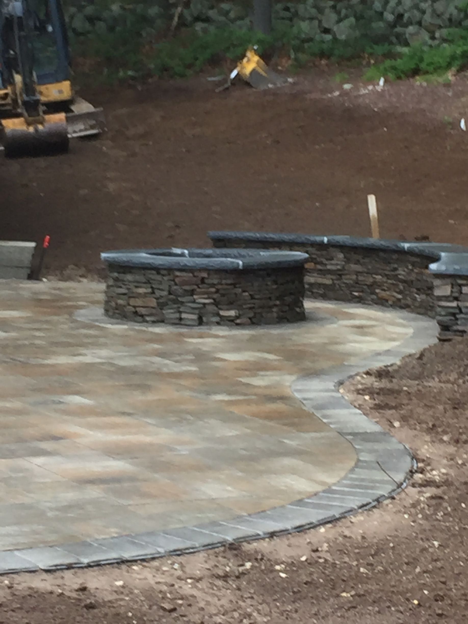A construction site with a bulldozer in the background