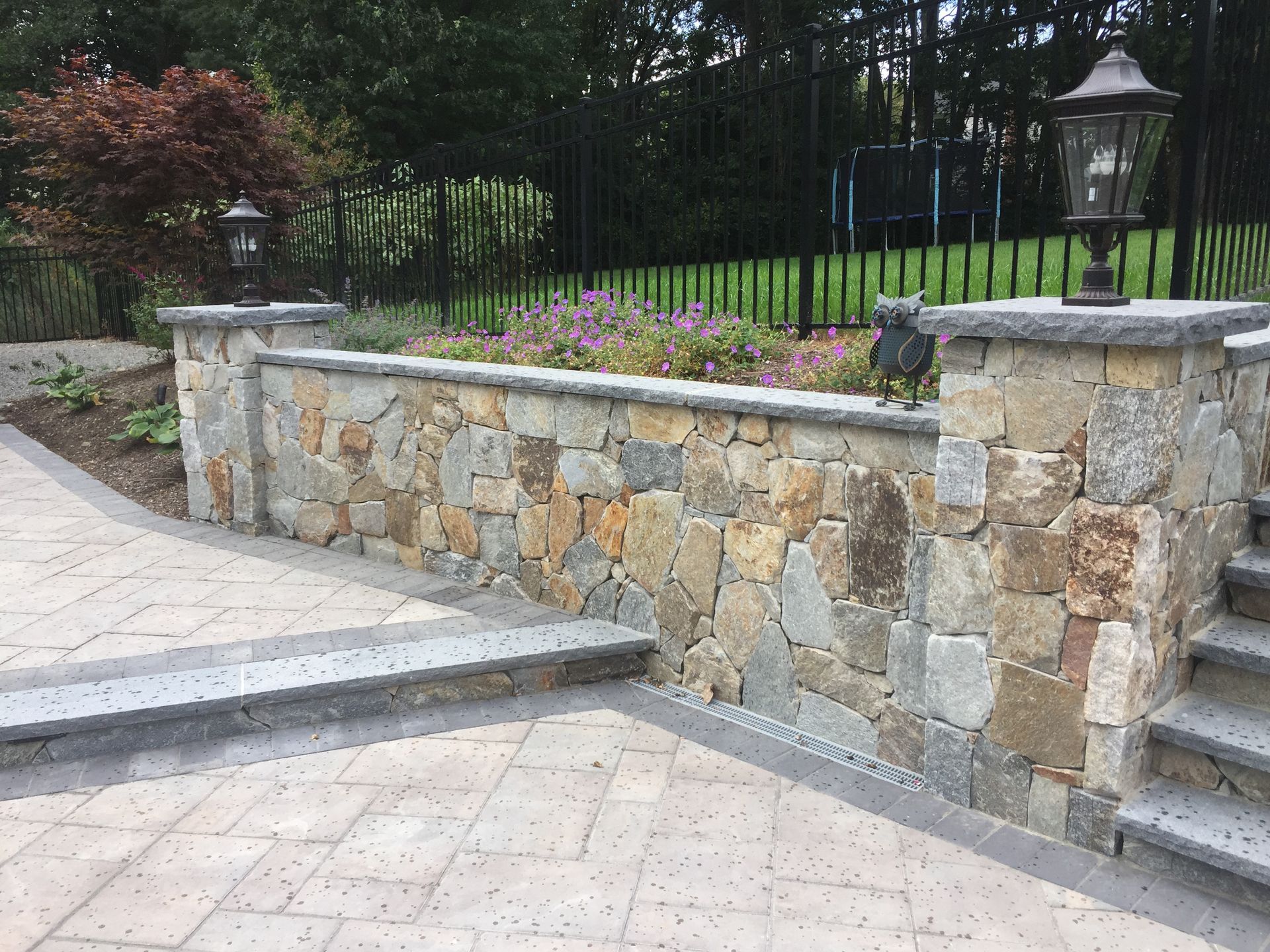 A stone wall with steps leading up to it