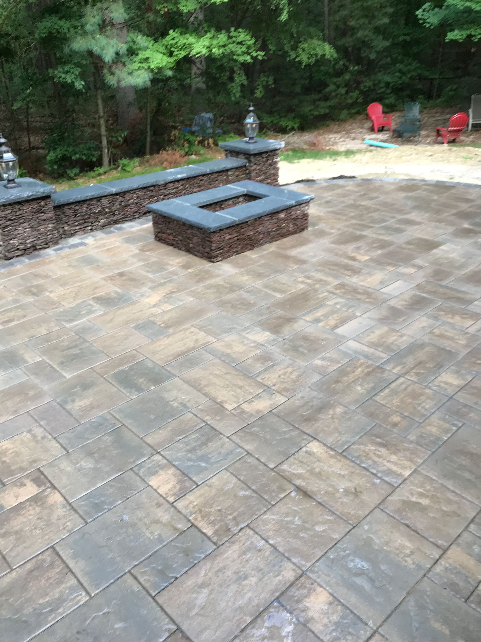 There is a fire pit in the middle of the patio.