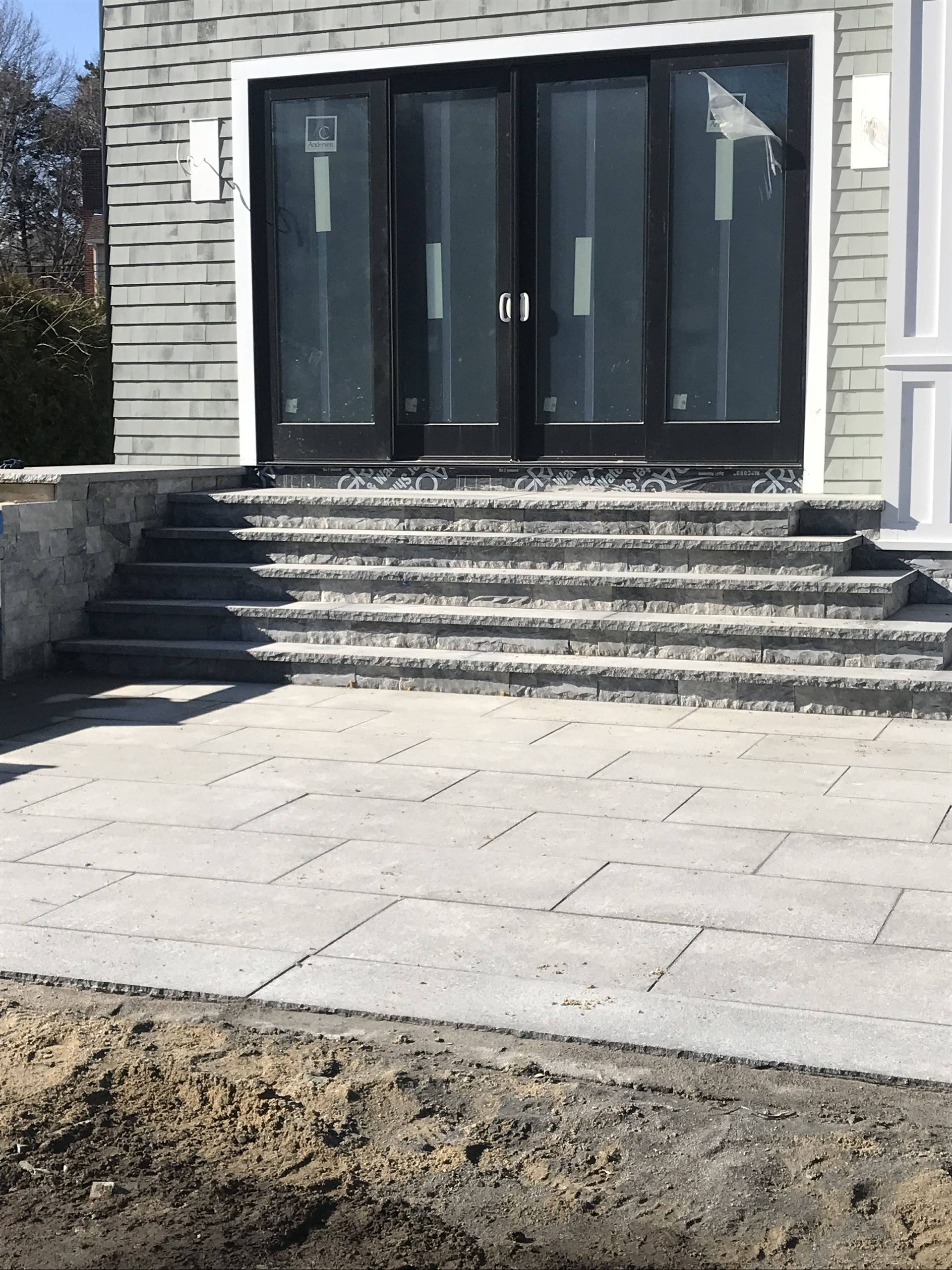 A house with stairs leading up to the front door