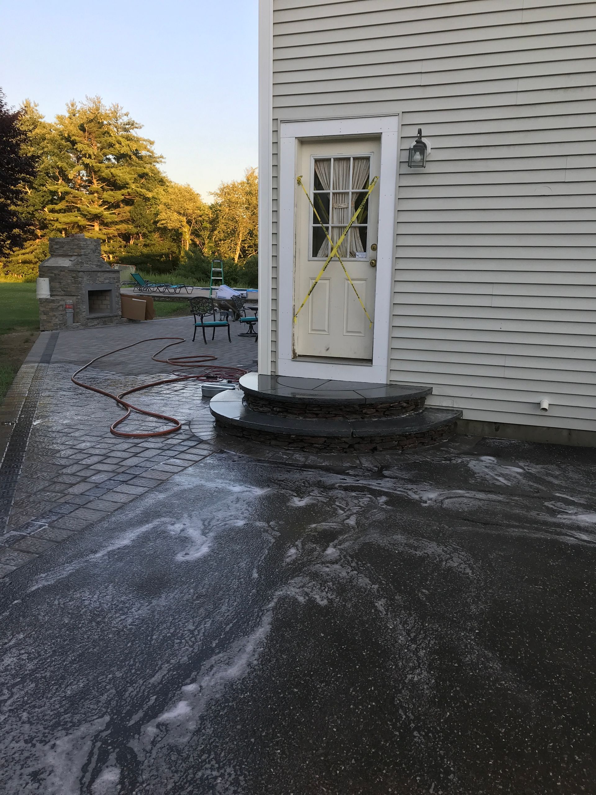 A white house with a white door and steps