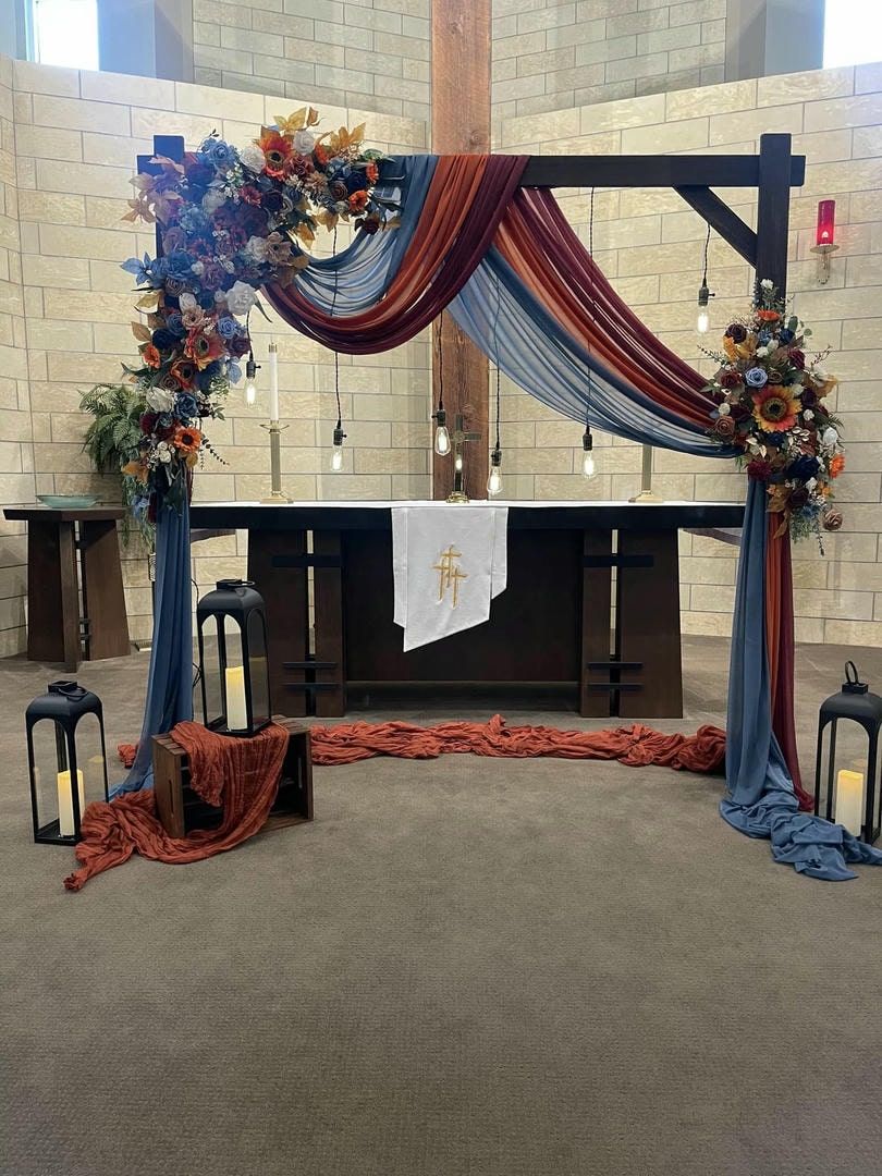 A church altar decorated with flowers and lanterns