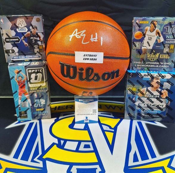 A wilson basketball is surrounded by boxes of cards