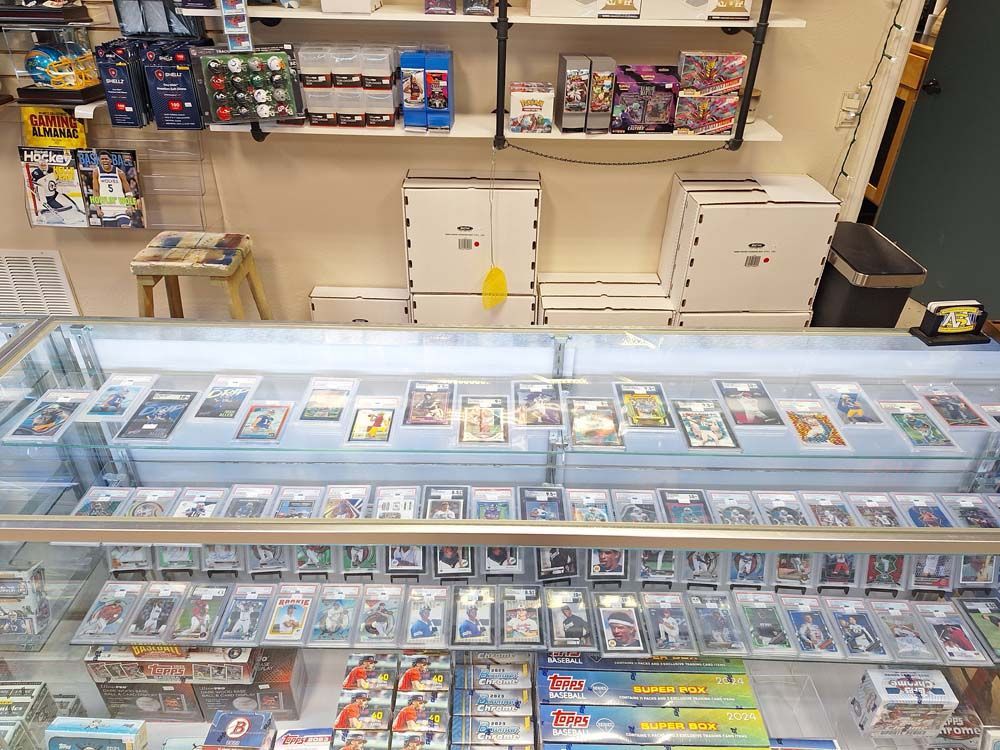 A display case filled with lots of cards in a store.