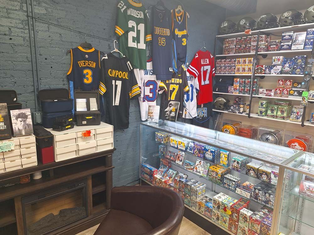 A store filled with lots of jerseys and toys.