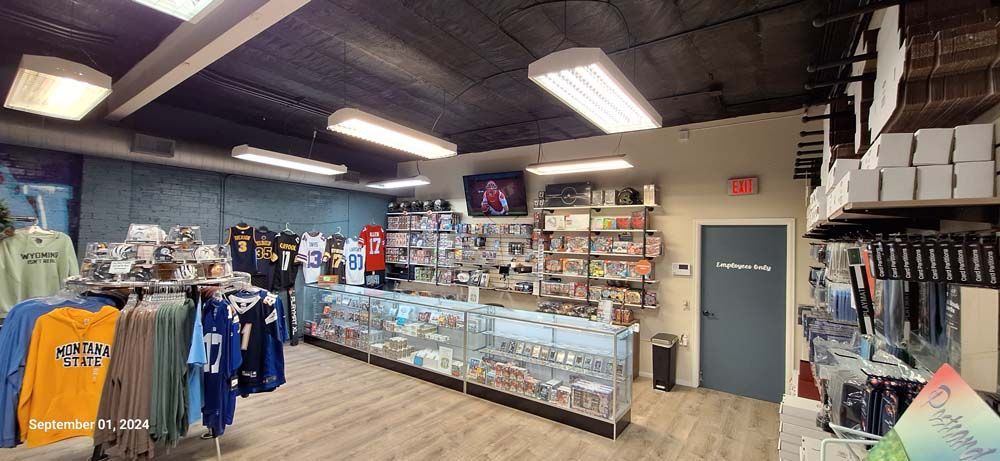 A store filled with lots of clothes and a counter.