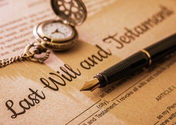 Fountain pen And Pocket Watch On A Last Will and Testament. — Probate Law In Youngstown, OH