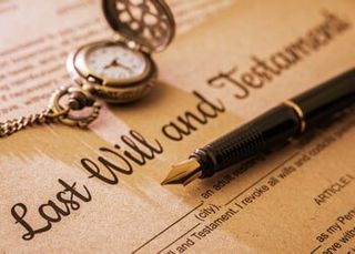 Fountain pen And Pocket Watch On A Last Will and Testament. — Probate Law In Youngstown, OH