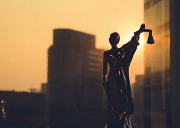 Silhouette of Themis With Building Background — Business Law In Youngstown, OH Silhouette of Themis With Building Background — Business Law In Youngstown, OH