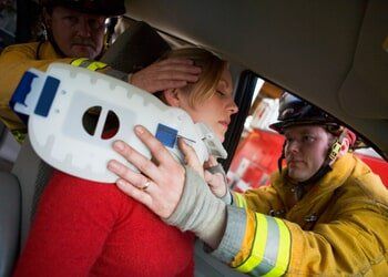 Woman Getting Helped With A Fireman — Personal, Injury In Youngstown, OH