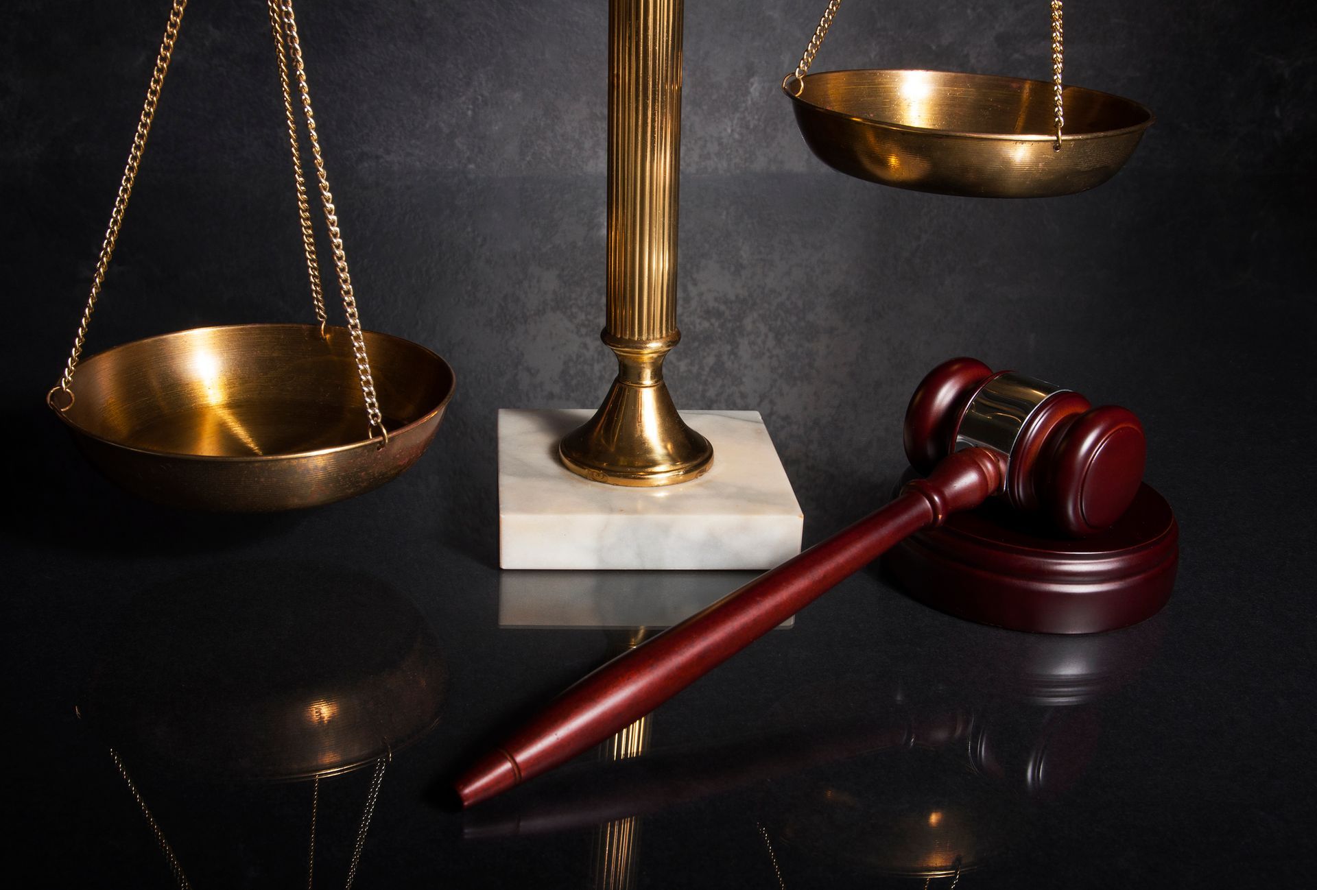 Legal concept image for a Criminal Defense Attorney with a gavel, scales of justice, and marble base