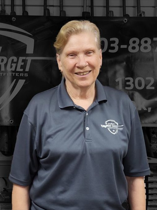 A woman standing in front of a sign that says target