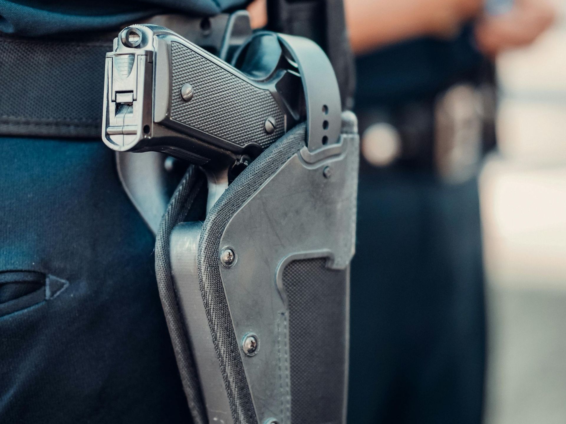 pistol in a black hip holster