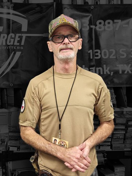 A man standing in front of a target sign