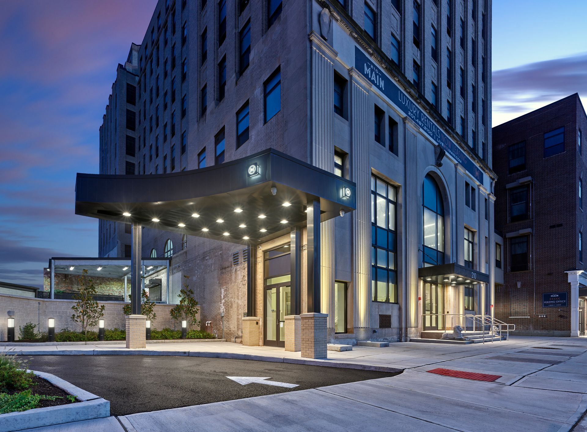 A large building with a parking lot in front of it
