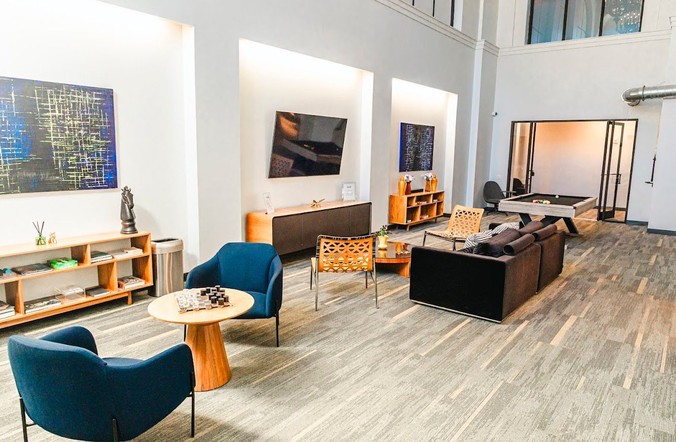 A living room filled with furniture and a television.