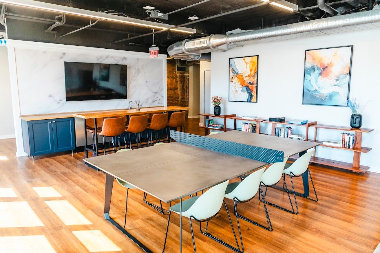 There is a ping pong table in the middle of the room.