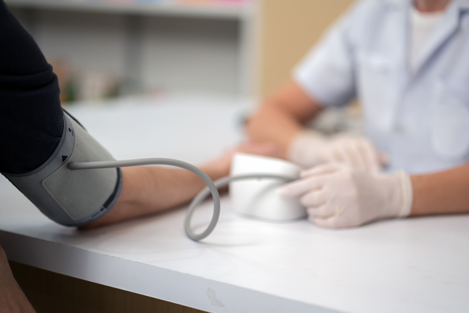Senior female doctor is checking the blood pressure of the patient - Gp, Doctor