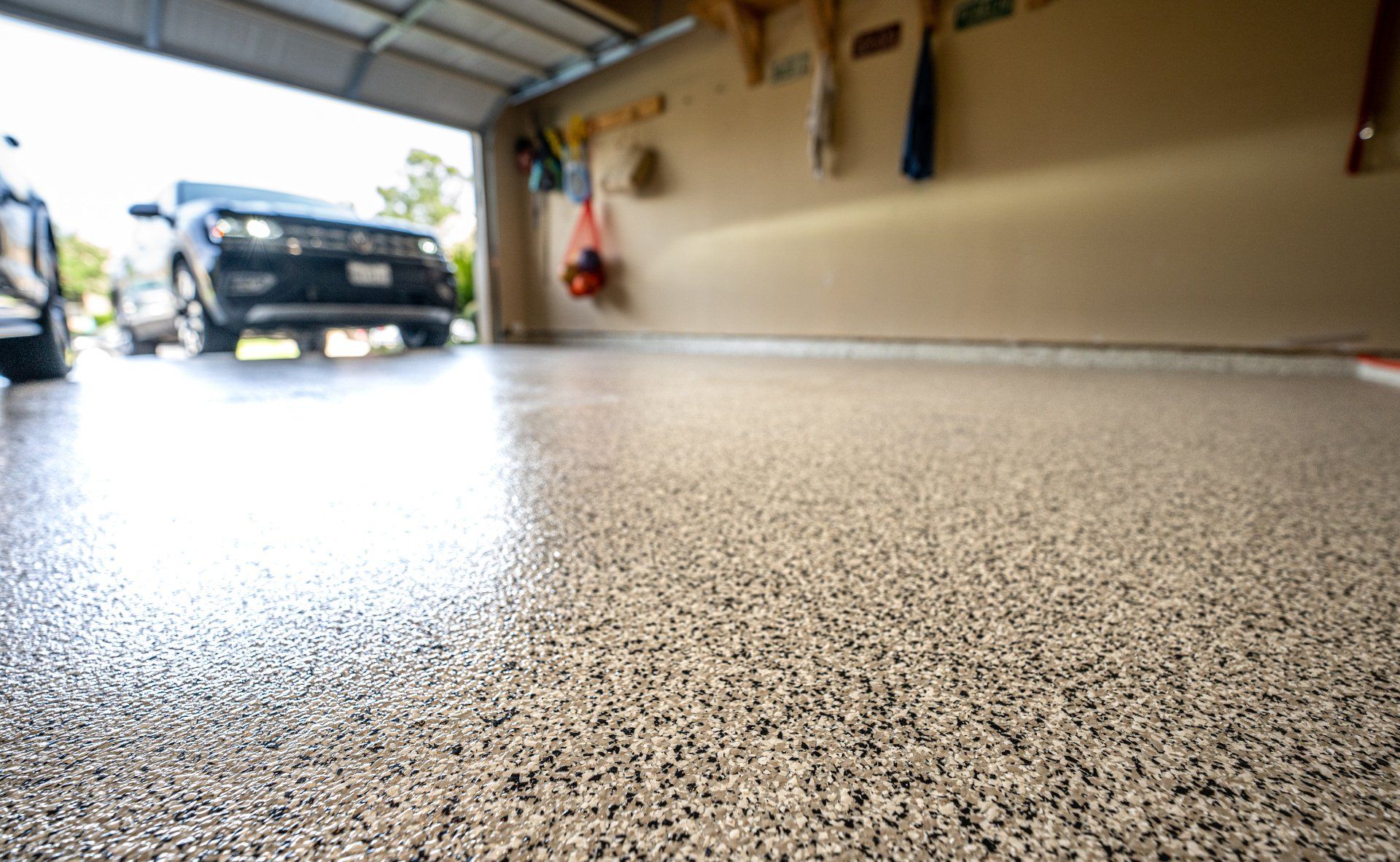 Newly installed epoxy garage floor with a glossy and seamless finish.