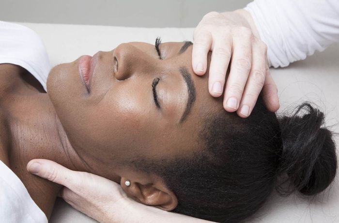 head and neck shot of a client receiving a Craniosacral therapy treatment