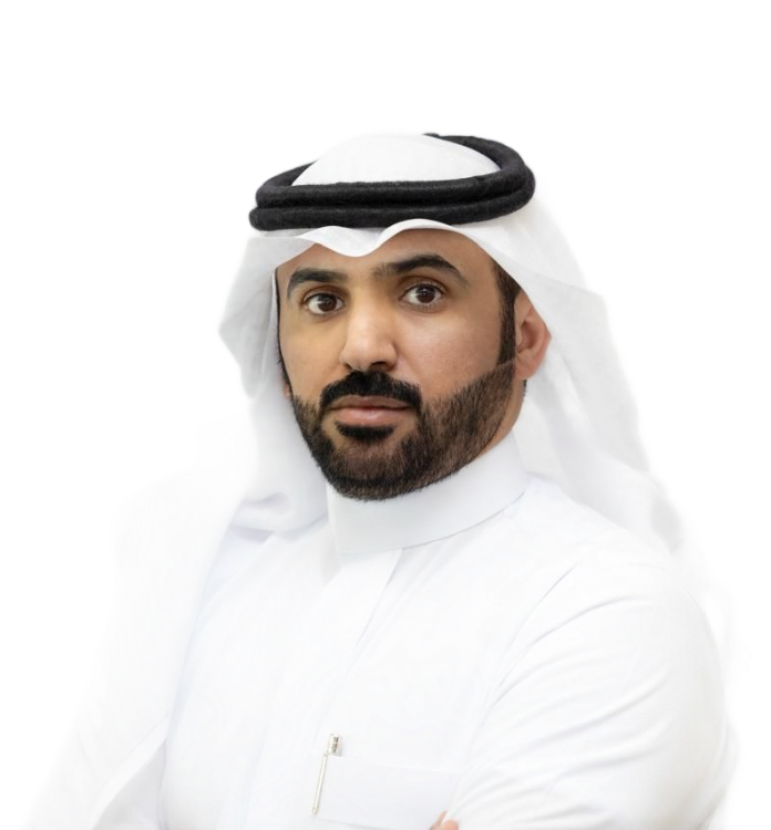 Man wearing traditional Arab head covering, white thobe, with a serious expression.