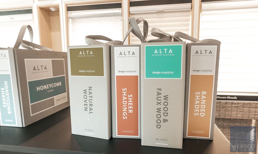 Display of Alta brand window shade samples in boxes.