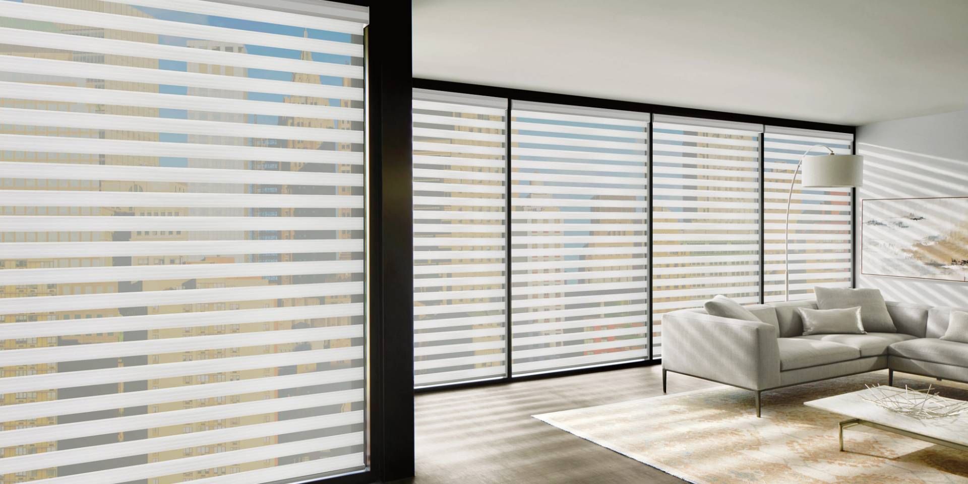 Hunter Douglas Designer Banded Shades, also known as zebra shades, on large windows