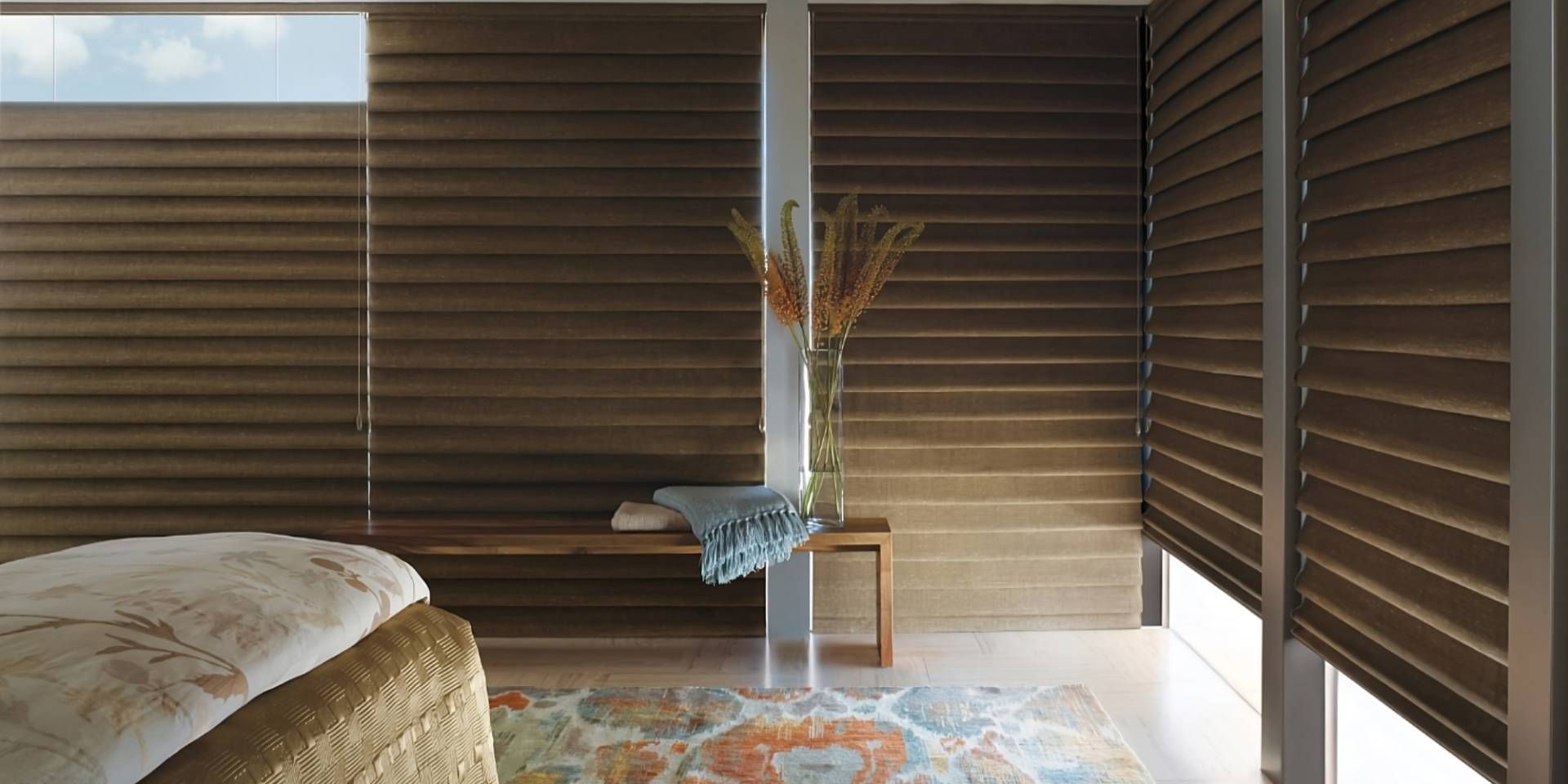 Hunter Douglas Vignette® Roman Shades with the Top-Down/Bottom-Up feature on large windows in a cozy