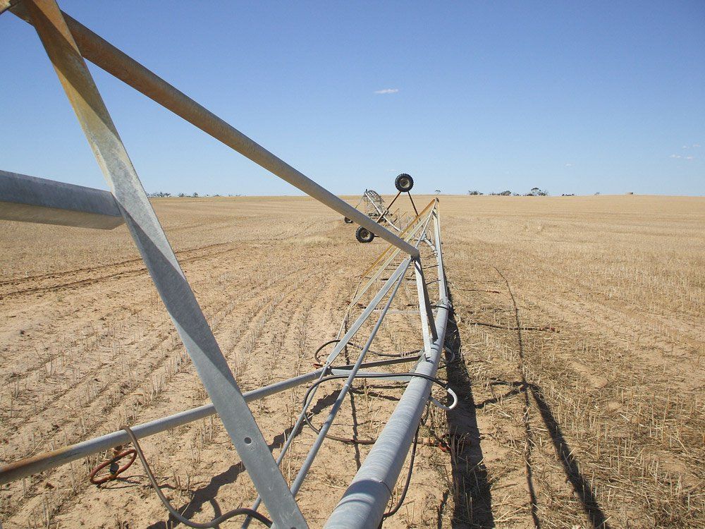 Closeup irrigation on dirt field