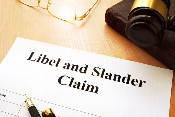 Libel and Slander Claims on a desk