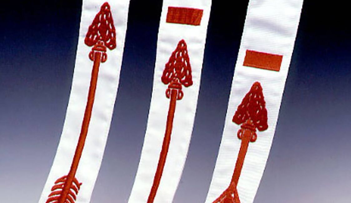 Three white ribbons with red arrows on them