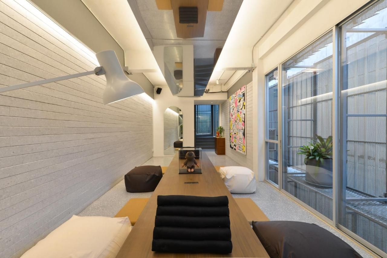 A long room with a table and a lot of windows