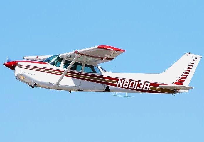 The wing of an airplane is visible through the window.