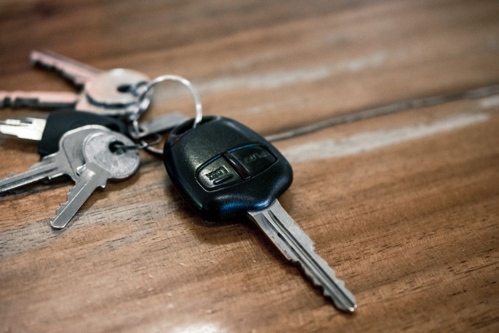 Keys and Car Remote on A Wooden Surface — CQR Locksmiths in Lightning Ridge, NSW