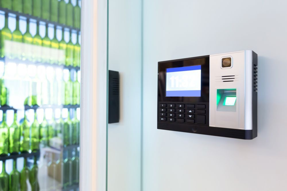 Fingerprint and Keypad Access Control Device Mounted on A White Wall — CQR Locksmiths in Walgett, NSW