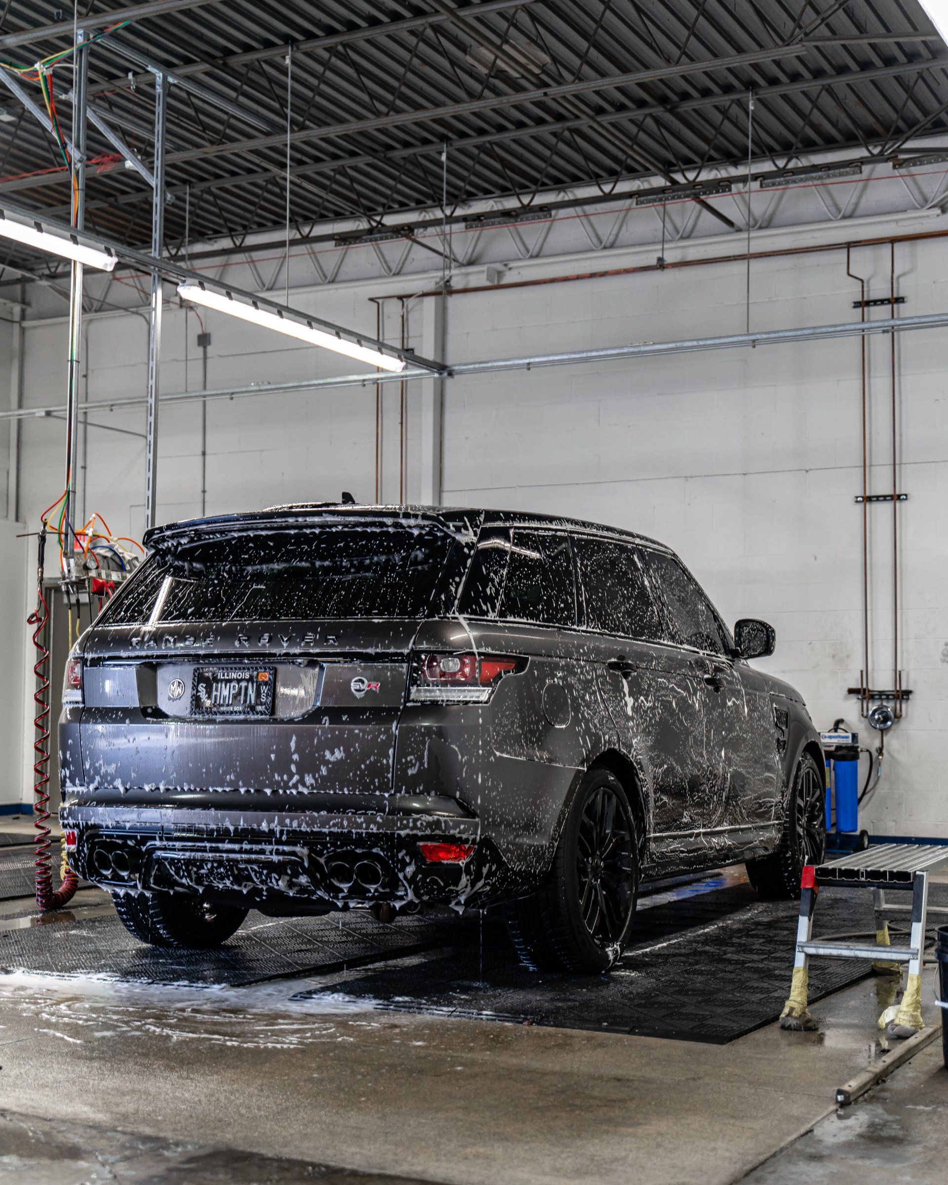 A car is being washed in a car wash.