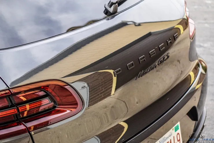 The rear end of a porsche macan gts is shown.