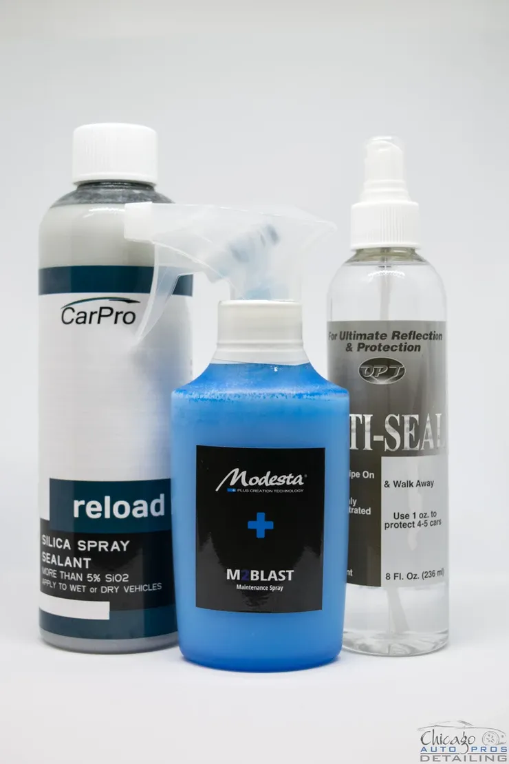 Three bottles of car pro products are sitting next to each other