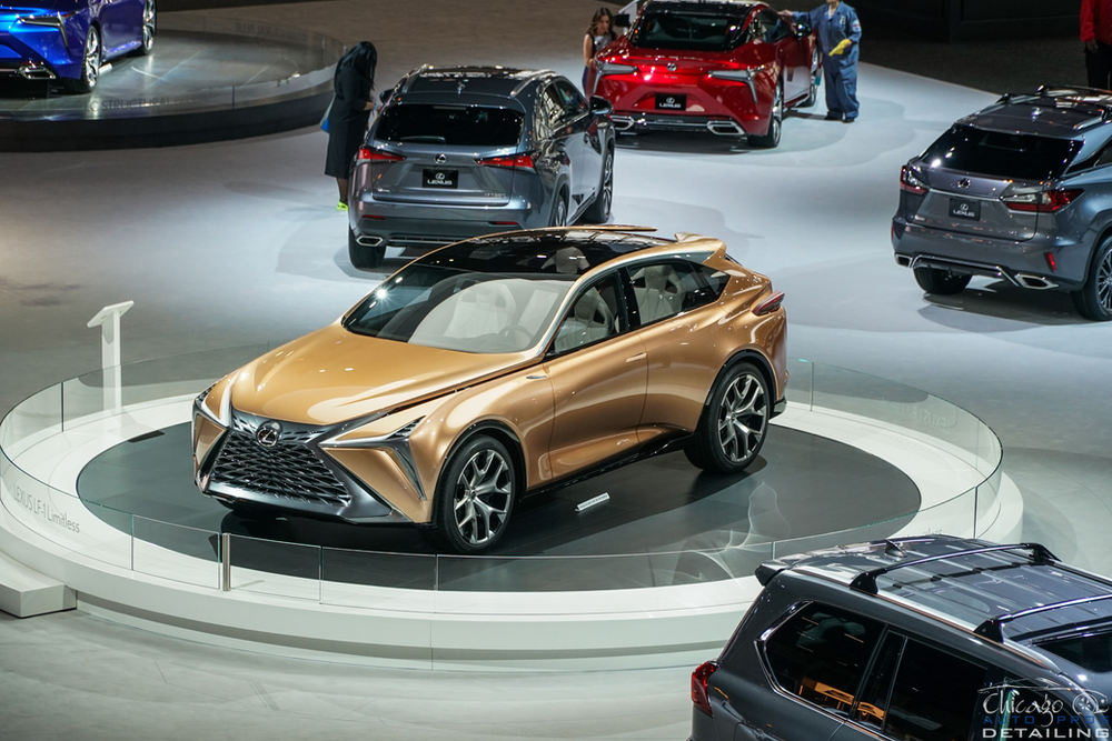 A group of cars are on display at a car show.