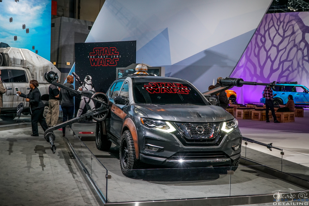 A nissan rogue concept car from star wars is on display at a car show.