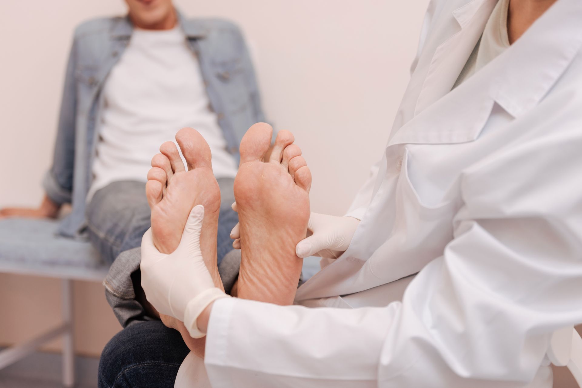 Foot doctor in Buffalo Grove, IL, gently inspecting the soles of a patient at Visit Lake Zurich Foot