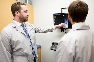 Foot Injuries — Podiatrist Checking X-Ray Machine in Lake Zurich,  IL