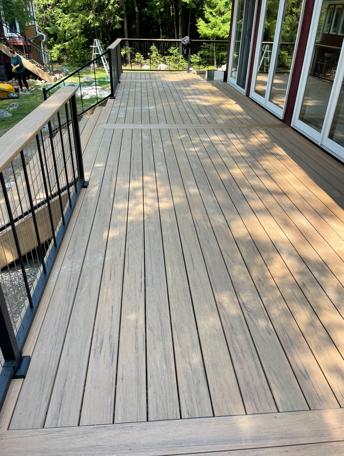 A living room with hardwood floors and a ceiling fan