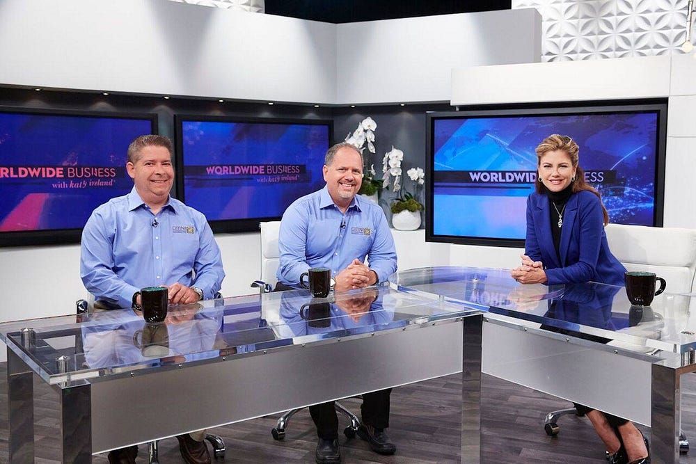 Group of anchors smiling | Elgin, IL | 'I' in Team Series By IA Business Advisors