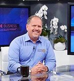 A man sitting and smiling | Elgin, IL | 'I' in Team Series By IA Business Advisors